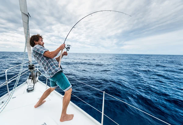 depositphotos 102182580 stock photo young man fishing hard